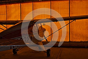 Piper tri-pacer airplane in a hanger