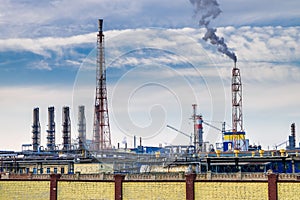 Pipes of a chemical enterprise plant. Air pollution concept. Industrial landscape environmental pollution waste of thermal power