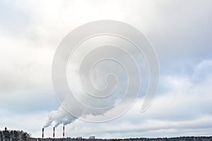 Pipes of a chemical enterprise plant. Air pollution concept. Industrial landscape environmental pollution waste of thermal power