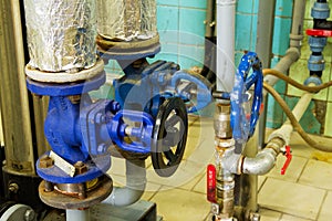 Pipes and faucet valves of heating system in a boiler room