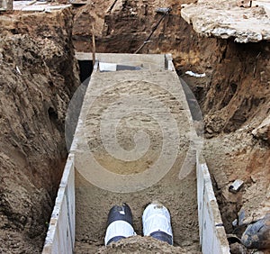 Pipes and heating system at house construction site.
