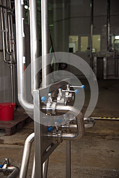 Pipes and levers on milk production factory