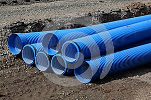 Pipes lie in a construction pit