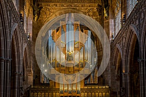 The pipes of a pipe organ in a cathedral.