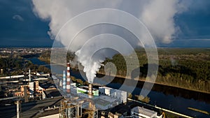 Pipes with smoke in a factory building. Concept of environmental pollution