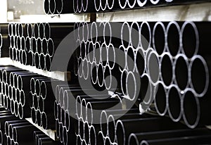 Pipes stacked in warehouse