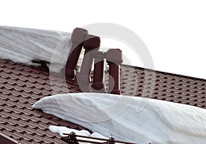 Pipes on tiled roof broken by snow ice infusion