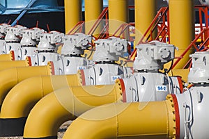 Pipes and valves are on the gas compressor station