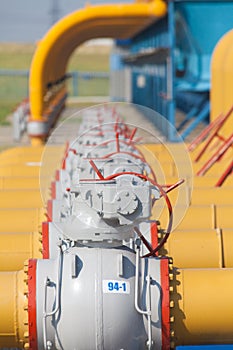 Pipes and valves are on the gas compressor station