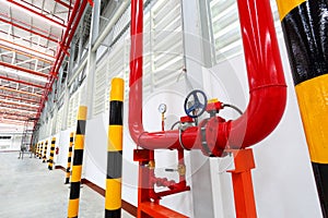 Pipes valves and pressure gauge of water system in warehouse