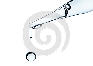 Pipette or Dropper with water drops. Concept for medicine, biology, cosmetic, pharmacy, perfume industry.