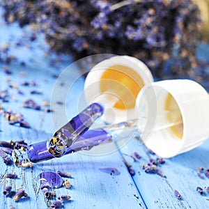 Pipettes with flower essence and lavender flowers photo