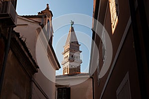 Piran with the belltower of St George's Parish Church is in the background