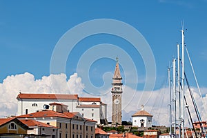 Piran - Fishing and sailing boats in serene harbor of coastal town Piran, Slovenia, Europe