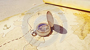 Pirate compass on the Treasure Map lying on the sand on the island of pirates. Vintage beautiful pirate compass lying on