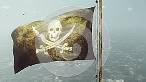 Pirate flag with Jolly Roger. Pirate flag in the wind with cloudy sky on the background of the sea before the storm. 3D