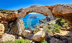Pirate ship through rock arch,cyprus photo