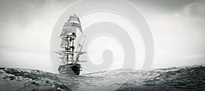 Pirate ship sailing on stormy ocean