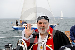 Pirate skipper at helm of boat