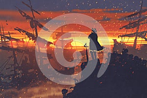 Pirate standing on treasure pile against ruined ships at sunset