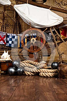 Pirates ship deck with steering wheel and flag