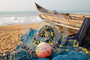 Pirogue and fisherman's nets on the beach of Grand Po Po in Benin