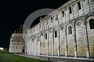 Pisa Cathedral and Baptistery or Battistero di San Giovanni Floodlit at Night, Tuscany, Italy