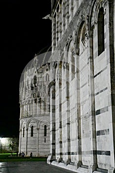 Pisa Cathedral and Baptistery or Battistero di San Giovanni Floodlit at Night, Tuscany, Italy