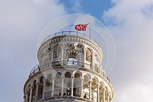 Pisa tower detail - showing the top roof area with the red flag 3
