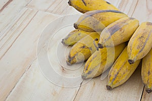 Pisang Awak banana, Kluai Nam Wa, Cultivate banana on wooden background, copyspace