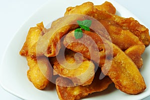 Pisang goreng or banana fritters on a plate photo
