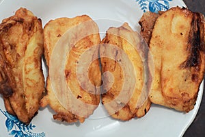 Pisang goreng or fried bananas on a white plate, Pisang goreng are fried foods that are often consumed by Indonesian people