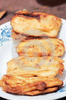 pisang goreng or fried bananas  on a white plate, Pisang goreng are fried foods that are often consumed by Indonesian people