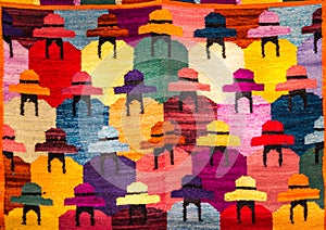 Pisaq, Peru - Traditional Colorful Peruvian Inca Textile Patterns on Woven Fabric at a Local Artisan Market Fair