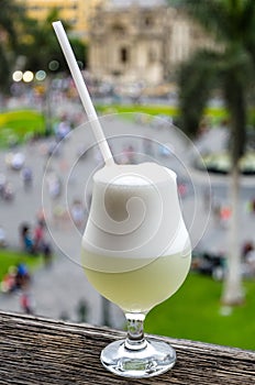 Pisco Sour with the background of the Plaza de armas de Lima - taken from the bar Moyas photo