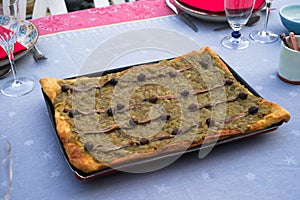 Pissaladiere on a table in summer