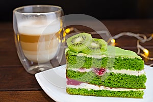 Pistachio cake with kiwi, cream and raspberry filling and Cappuccino coffee