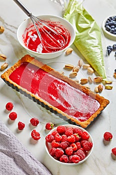 Pistachio ganache tart with raspberry pectin jelly