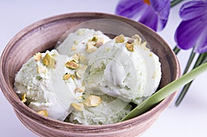 Pistachio ice cream in an earthenware bowl