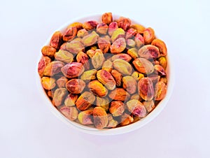 Pistachio nut kernels dry fruit food heap in a bowl pista closeup view image stock photo