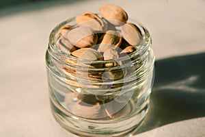 Pistachio nuts in a glass container