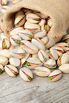 Pistachio nuts with shell on the wooden board