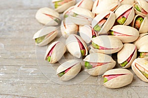 Pistachio nuts with shell on the wooden board