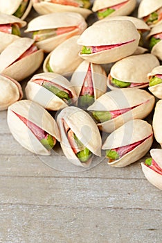 Pistachio nuts with shell on the wooden board