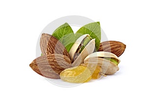Pistachio nuts wits raisins, almonds and leaves in closeup isolated photo