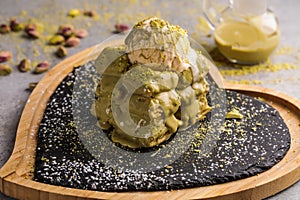 Pistachio Waffle with ice cream scoop served in dish isolated on table top view of cafe waffles food dessert