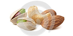 Pistachios, almonds and cashew nuts mix isolated on white background