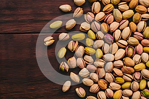 Pistachios arranged on kitchen table, nutritious and crunchy snack