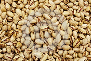 Pistachios background with many nuts