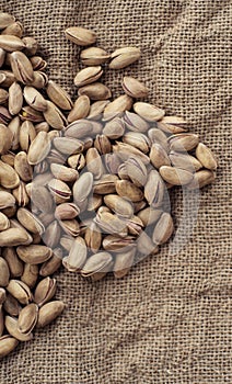 Pistachios on burlap sack. Healthy food high protein. Dietary nutrition. close-up